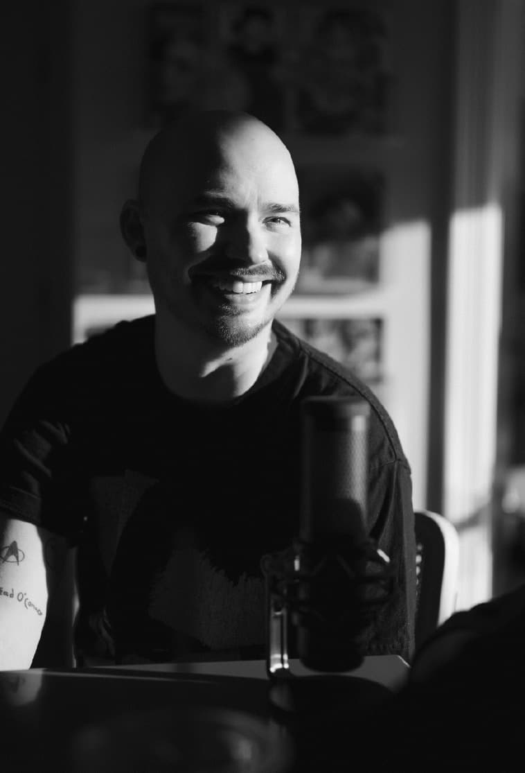 Loren Rice, smiling, in a sunlit room
